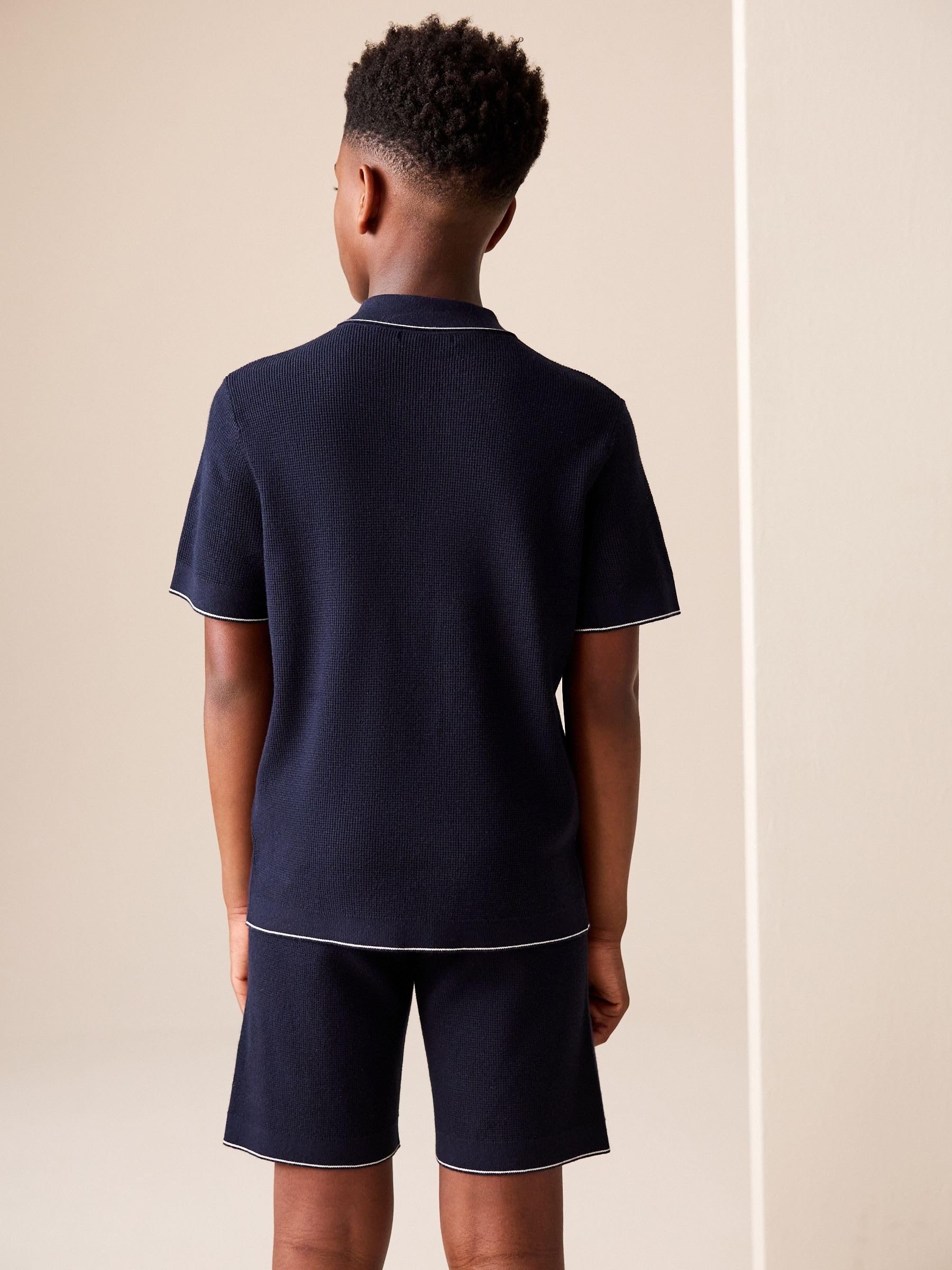 Next Completo Bambino Polo e Shorts 134 Maglia Testurizzata